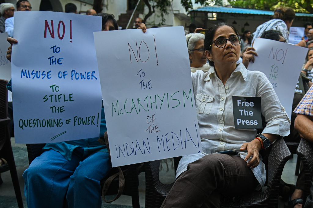 India Members of the media hold placards in a protest against the raids of homes of journalists and writers belonging a news portal in New Delhi, India on Oct. 04, 2023. Police Raids
