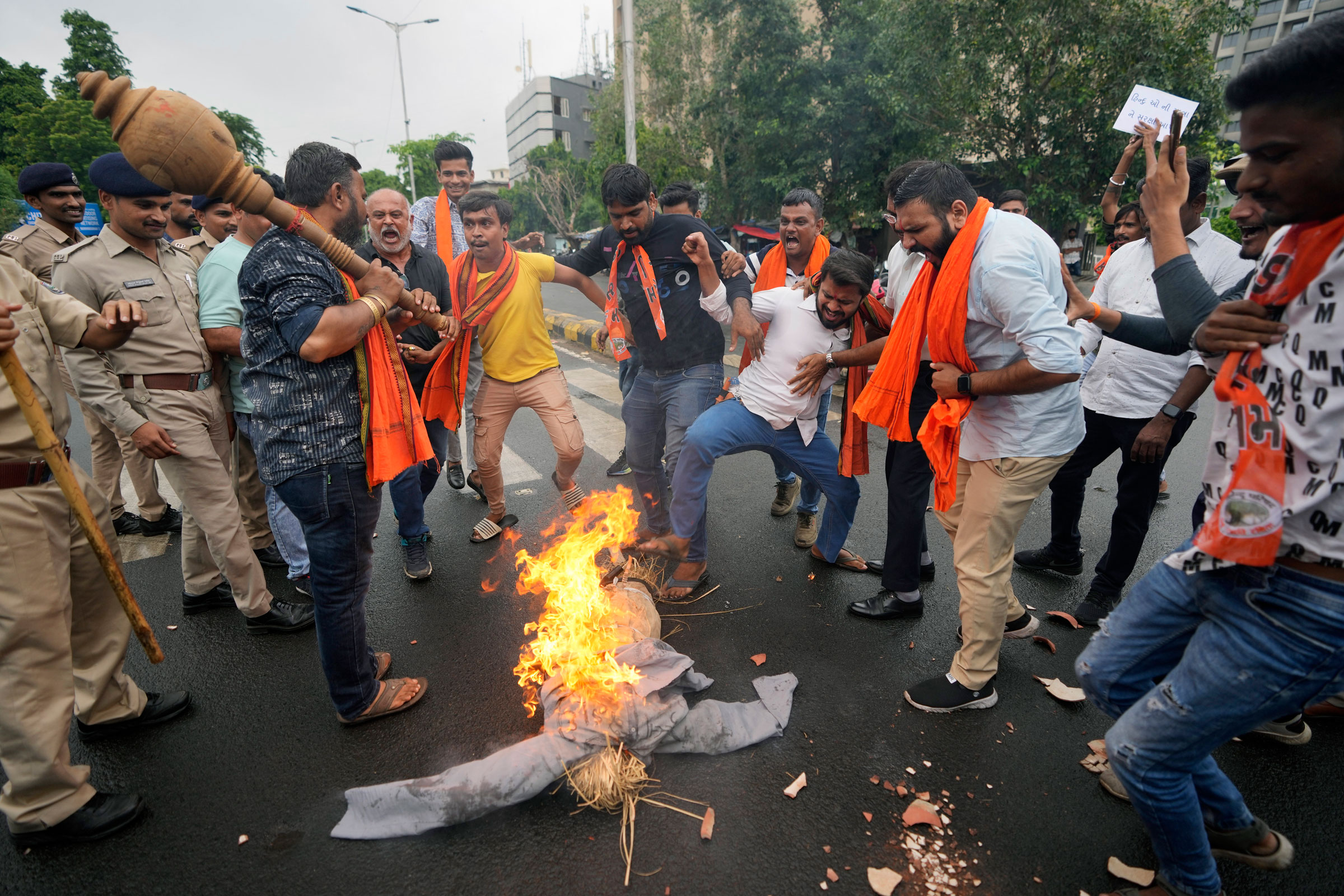 right-wing Hindu groups burn an effigy and shout slogans in Ahmedabad, India