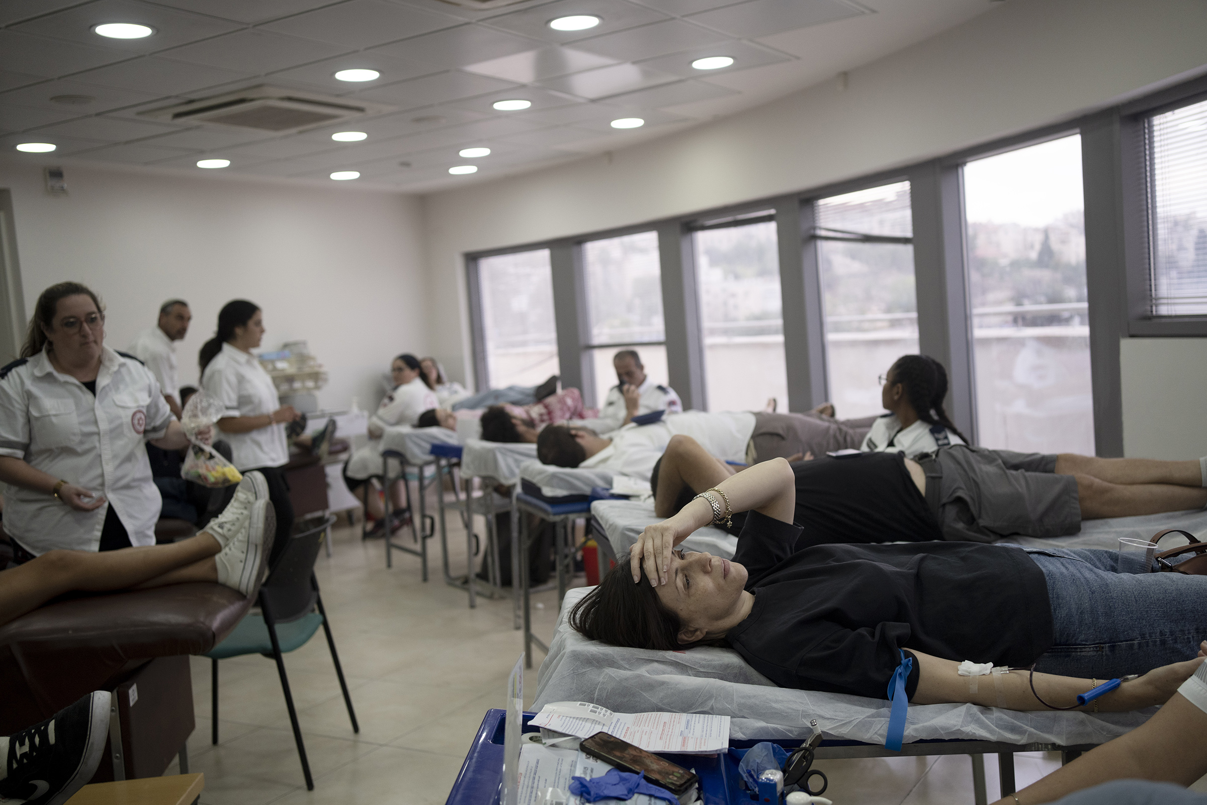 Israelis donate blood at Magen David Adom emergency service in Jerusalem, on Oct. 7, 2023.