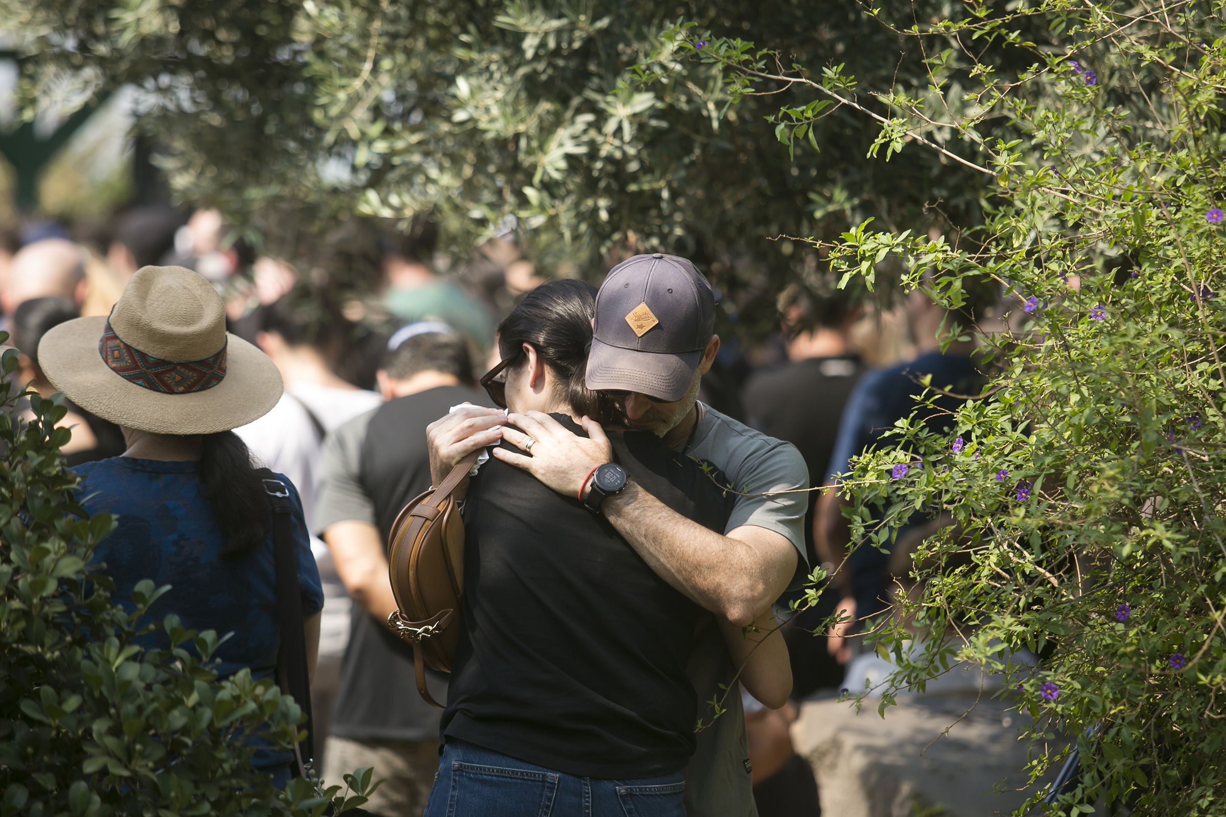Family and friends of May Naim, 24, who was killed by Hamas, react during her funeral in Gan Haim, Israel, on Oct. 11, 2023.