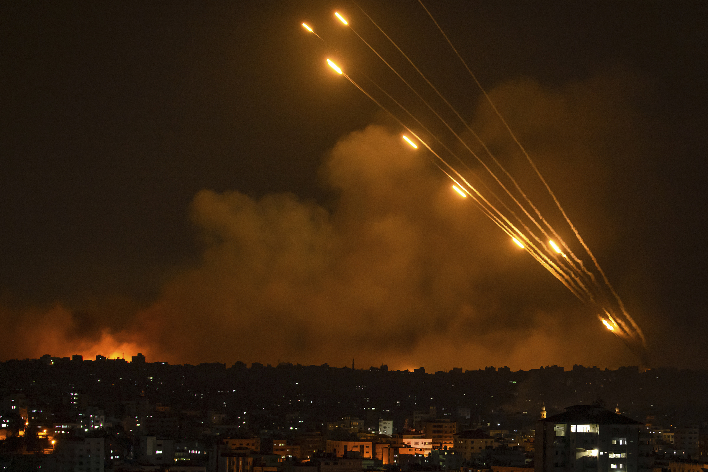 Rockets are fired toward Israel from the Gaza Strip, Oct. 8, 2023.