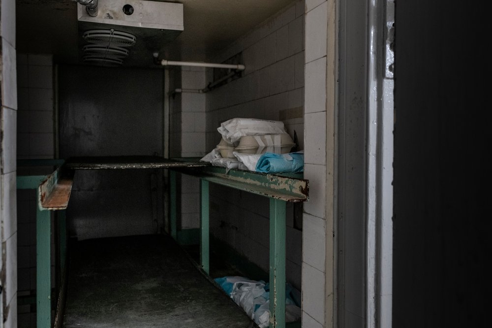 About 20 fetuses wrapped in cloth and paper in a fridge at a hospital morgue. The fetuses, many of which were born prematurely or with severe malformations, were abandoned. 