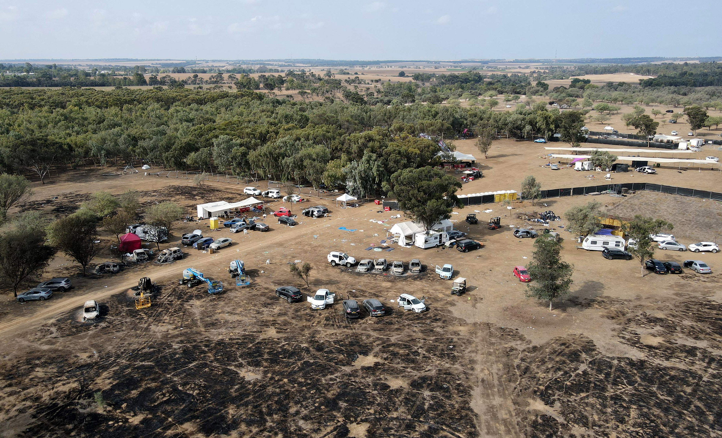 An aerial picture shows the abandoned site of the Supernova Festival, following an attack by Hamas militants, in the Negev desert in southern Israel, on Oct. 10, 2023.