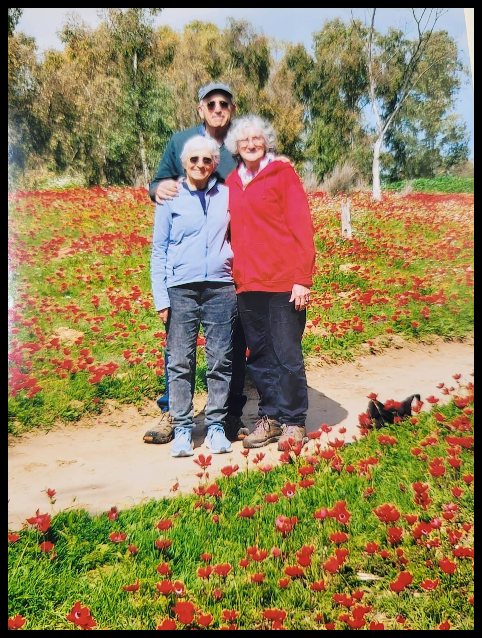 Vivian Silver, left, with Susan Levinstein, right, in fields near Kibbutz Be'eri.