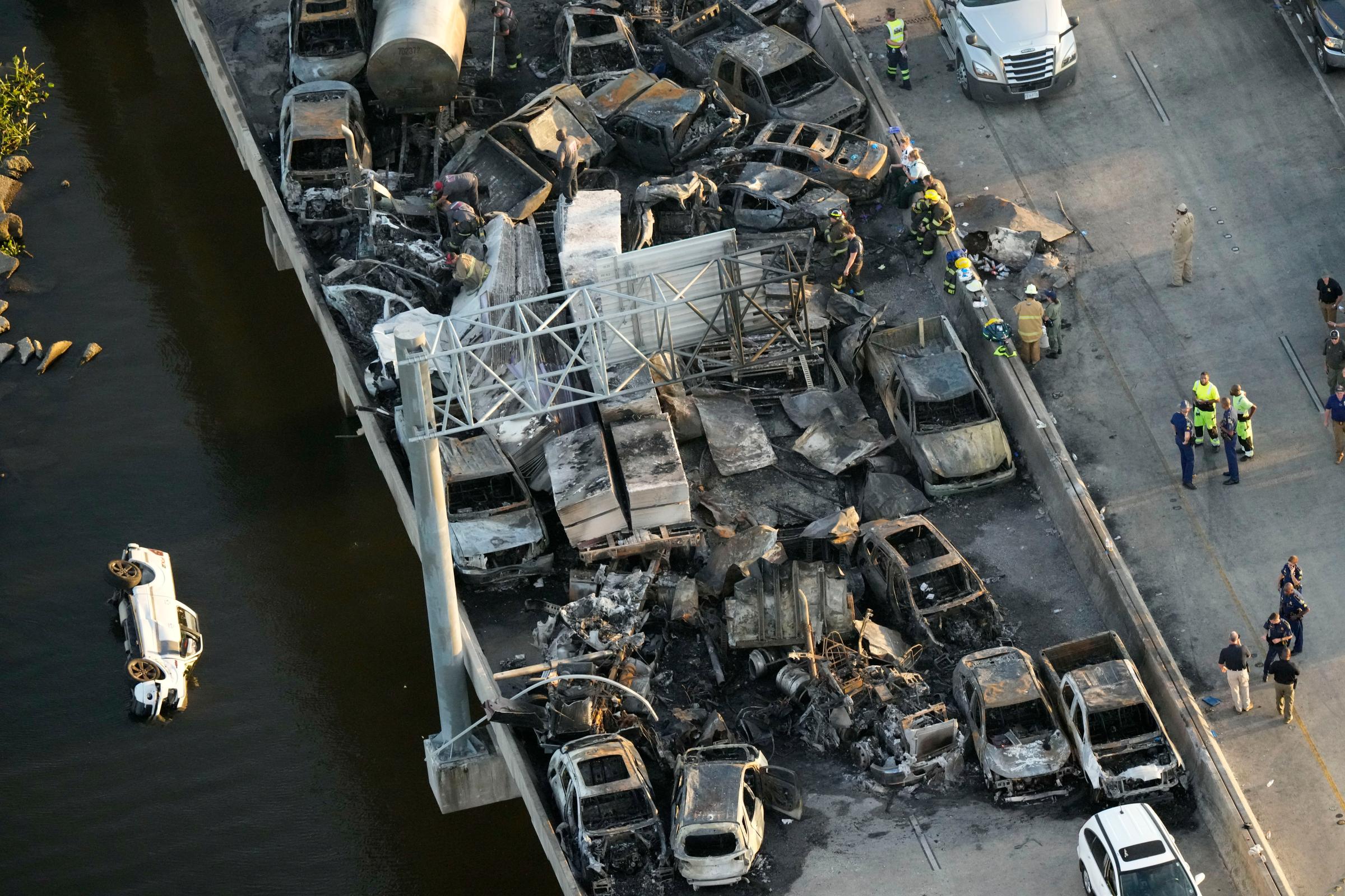 In this aerial photo, responders are seen near wreckage in the aftermath of a multi-vehicle pileup caused by "superfog" on I-55 in Manchac, La., Oct. 23.