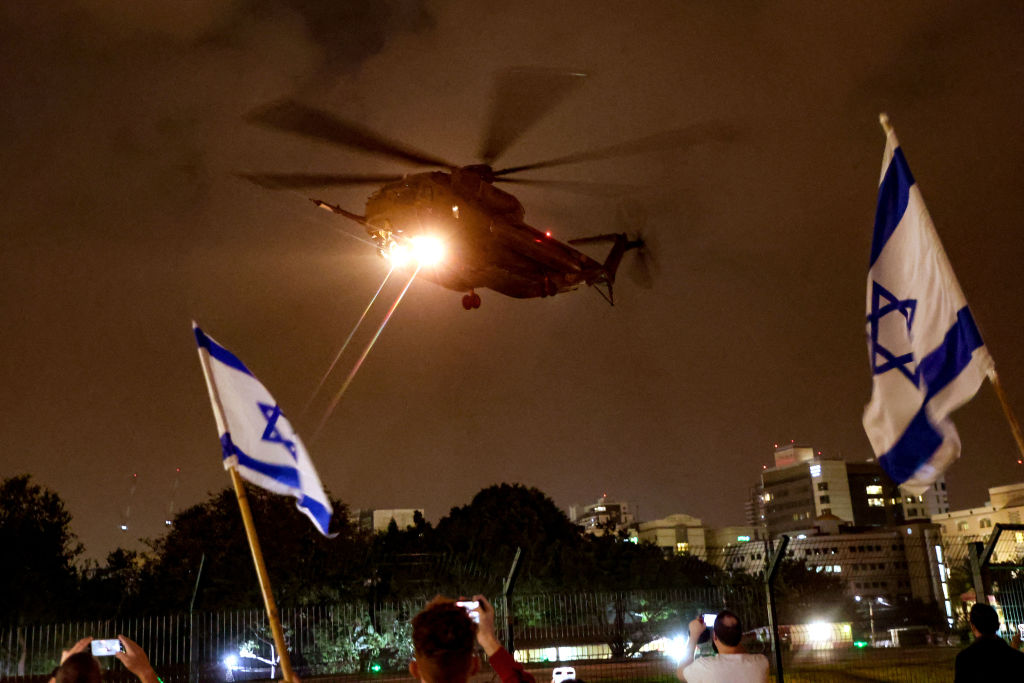 A helicopter transports hostages released by Hamas