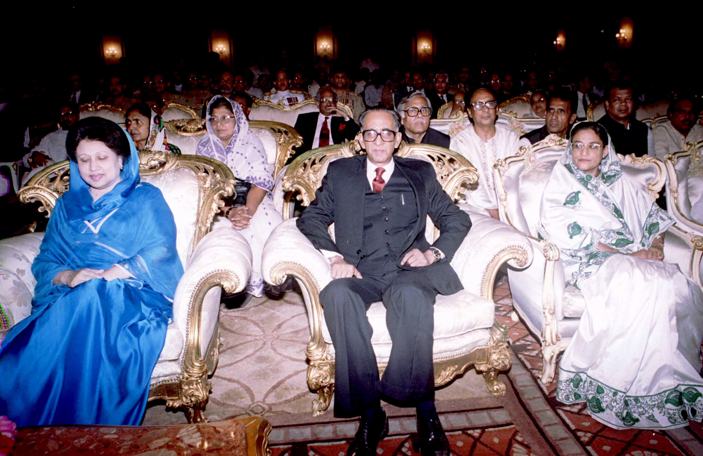 Bangladesh's then newly appointed caretaker government head ex-Chief Justice Habibur Rahman, center, is flanked by outgoing prime Minister Khaleda Zia, left, and then opposition leader Sheikh Hasina, right at the swearing-in for Rahman at the presidential palace on March 30. Rahman has been appointed as chief of the interim administration to oversee general elections expected in May or June.