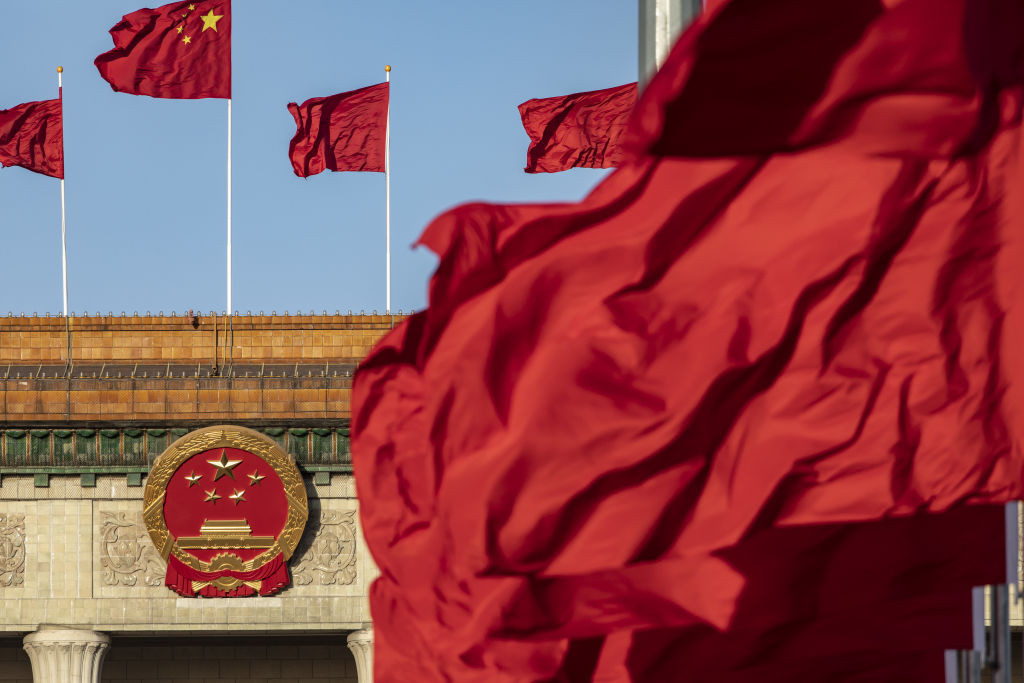 Chinese national flags fly over Tiananmen Square along with other red flags ahead of the fifth plenary session of the First Session of the 14th National People's Congress (NPC) at the Great Hall of the People in Beijing, China, on Sunday, March 12, 2023.