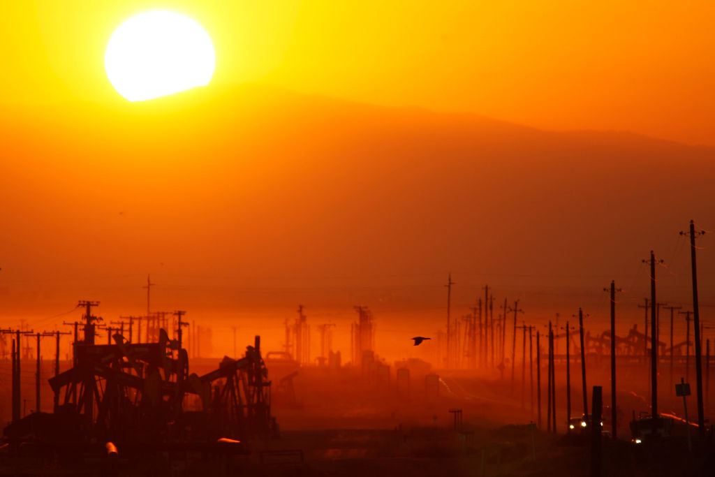 The sun rises over an oil field over the Monterey Shale formation March 24, 2014 near Lost Hills, California.