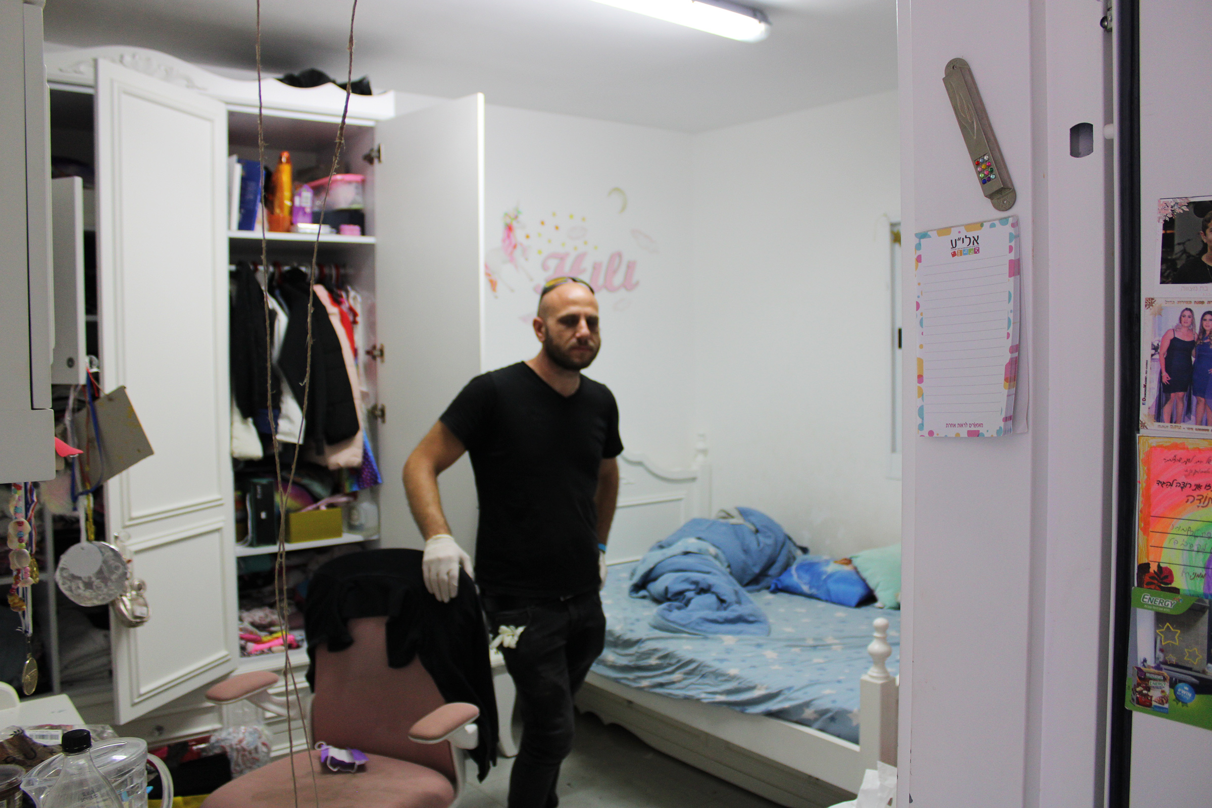 Maor Moravia stands in his daughter's bedroom, which also serves as the family's safe room.