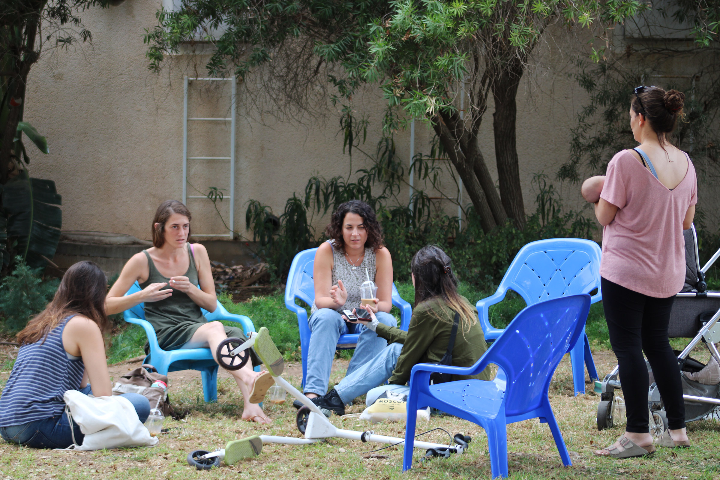 A group of survivors from Kfar Aza, including Jessica and Amit (second and third from left), outside their temporary home at Hotel Shefayim, on Oct. 29. Jessica's husband was killed on Oct. 7.