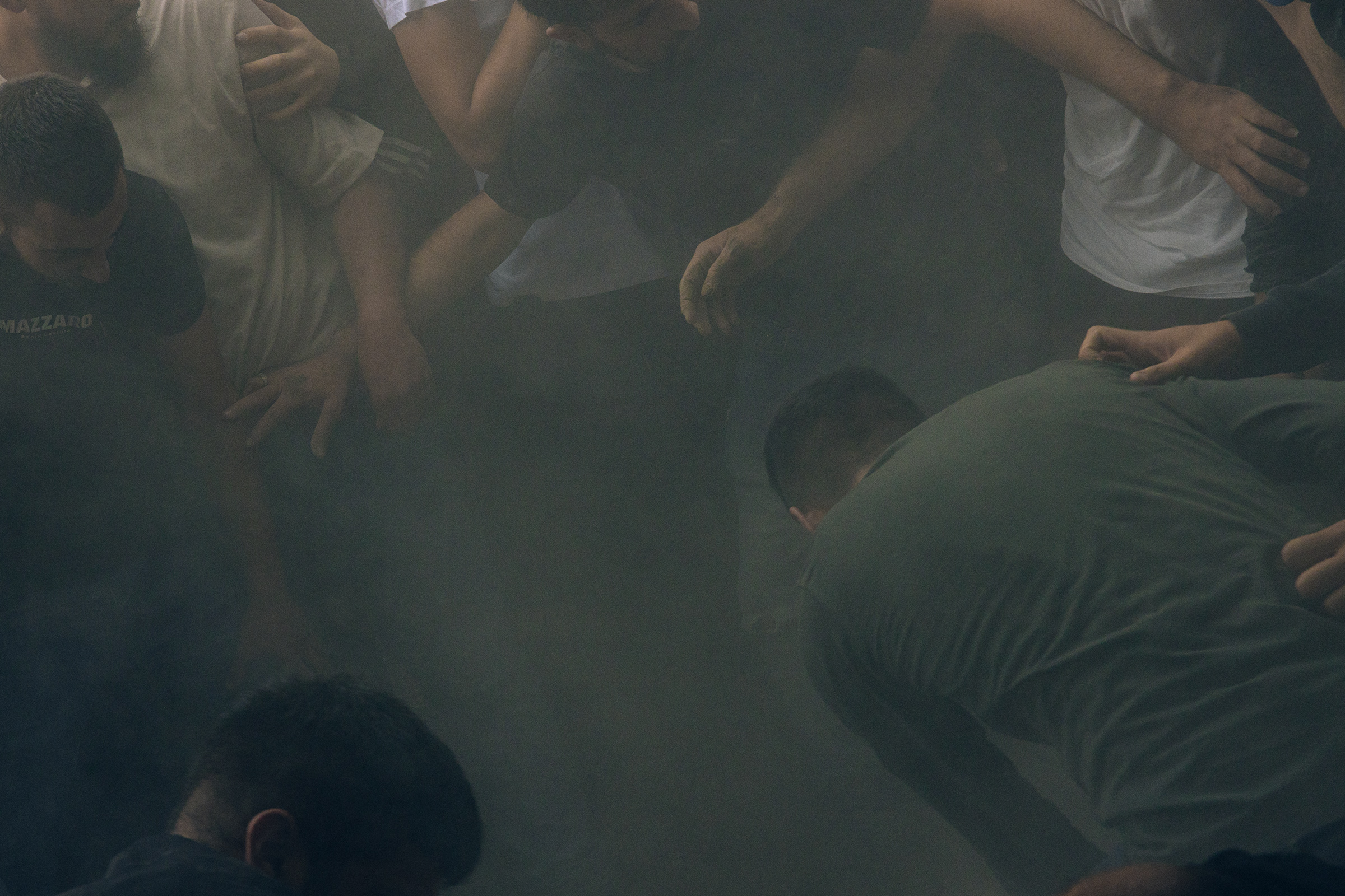 Dust settles as Yasser al-Kisba, 17, is laid to rest at Qalandia refugee camp on Oct. 9.