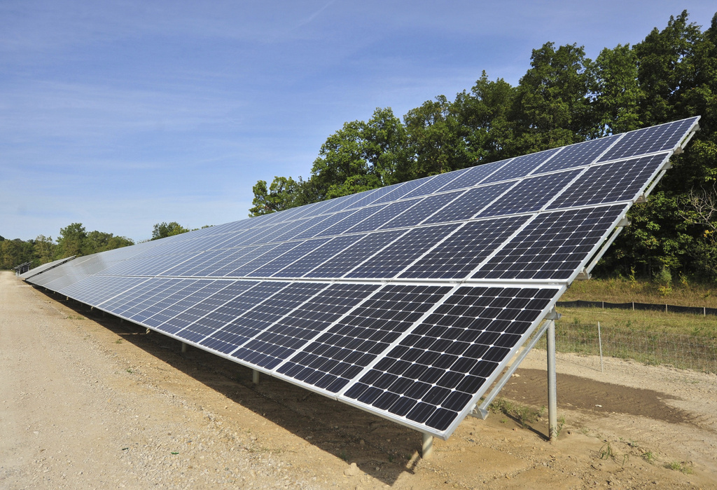One of more than 4,000 solar panels constructed by DTE Energy lines a 9.37-acre swath of land in Ann Arbor Township, Mich., Sept. 15, 2015. 
