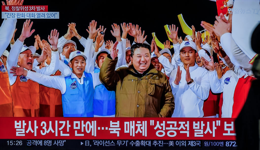 A TV at Seoul's Yongsan Station shows North Korean leader Kim Jong Un and a report that North Korea's reconnaissance satellite, its third launch attempt this year, has entered orbit on Nov. 21, 2023.