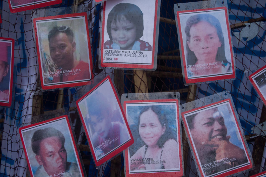 Portraits of alleged victims of the Philippine 'war on drugs' are displayed during a protest on President Rodrigo Duterte's State of the Nation Address (SONA) Monday, July 22, 2019 in Manila, Philippines.