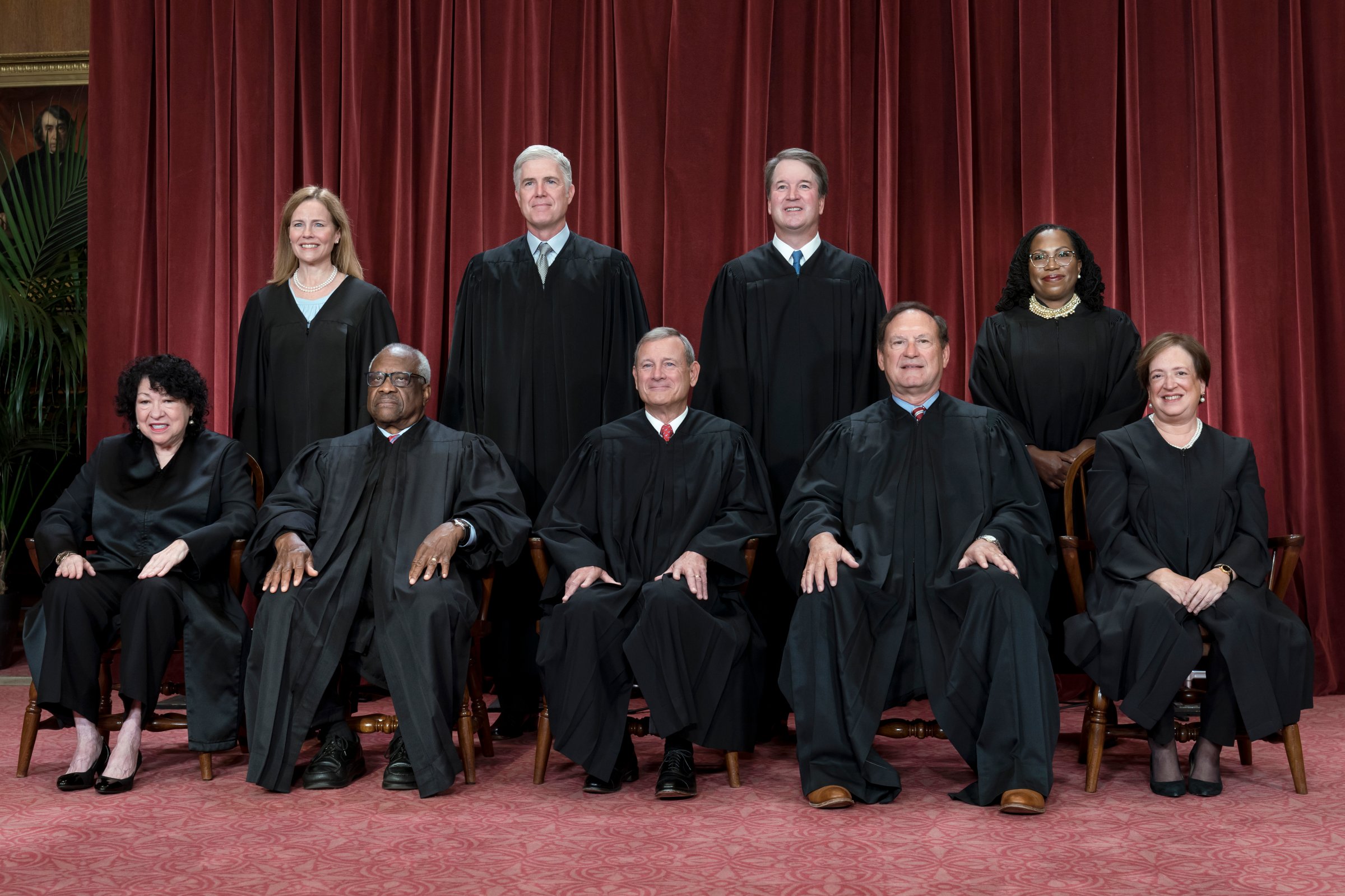 Members of the Supreme Court sit for a new group portrait following the addition of Associate Justice Ketanji Brown Jackson, at the Supreme Court building in Washington, Oct. 7, 2022.