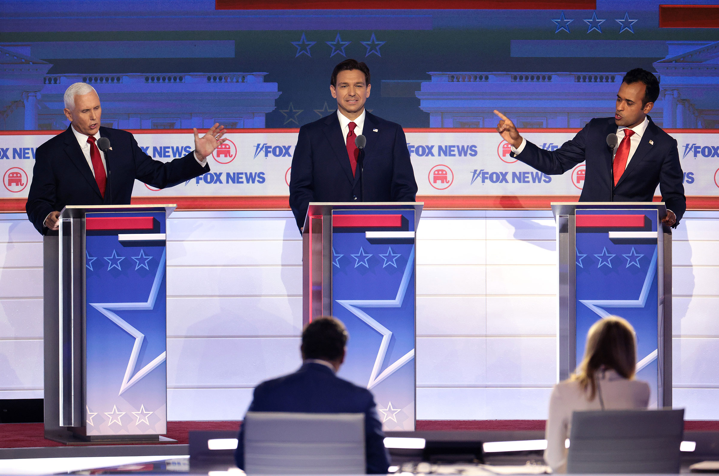 Republican presidential candidates, former Vice President Mike Pence, Florida Gov. Ron DeSantis and Vivek Ramaswamy participate in the first debate of the GOP primary season in Milwaukee, Wis. on Aug. 23.