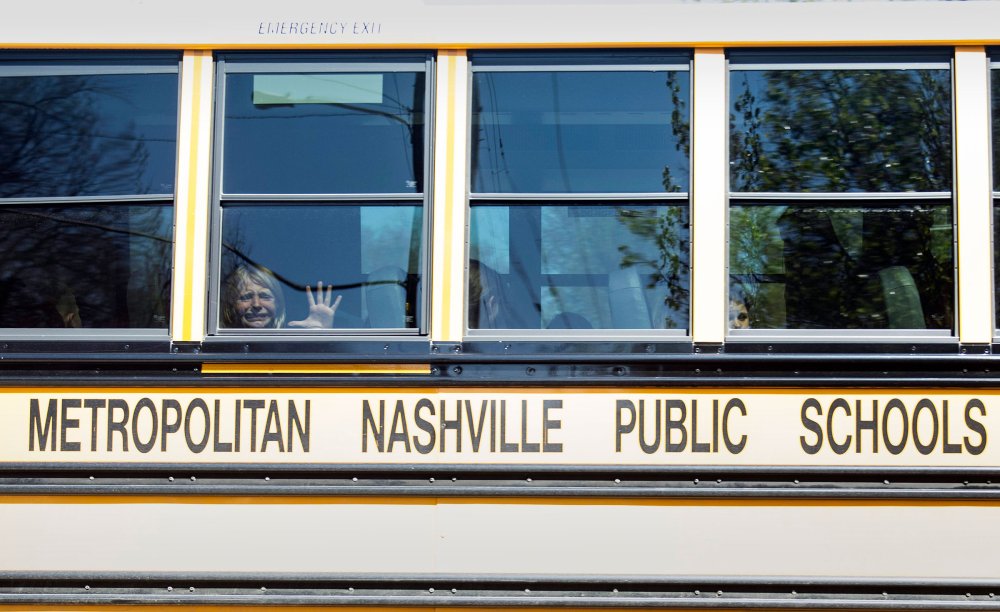 A child cries while on the bus leaving The Covenant School following a mass shooting at the school in Nashville, Tenn., on March 27.