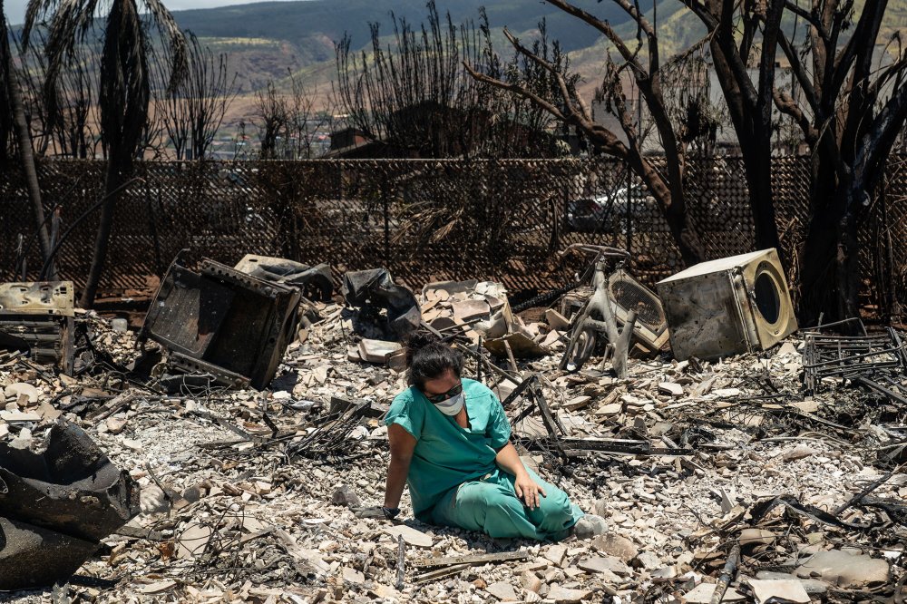 Sarah Salmonese sits where her apartment once stood in Lahaina, Maui, Hawaii, two days after it was devastated by wildfire, on Friday, Aug. 11, 2023. (Go Nakamura/The New York Times)