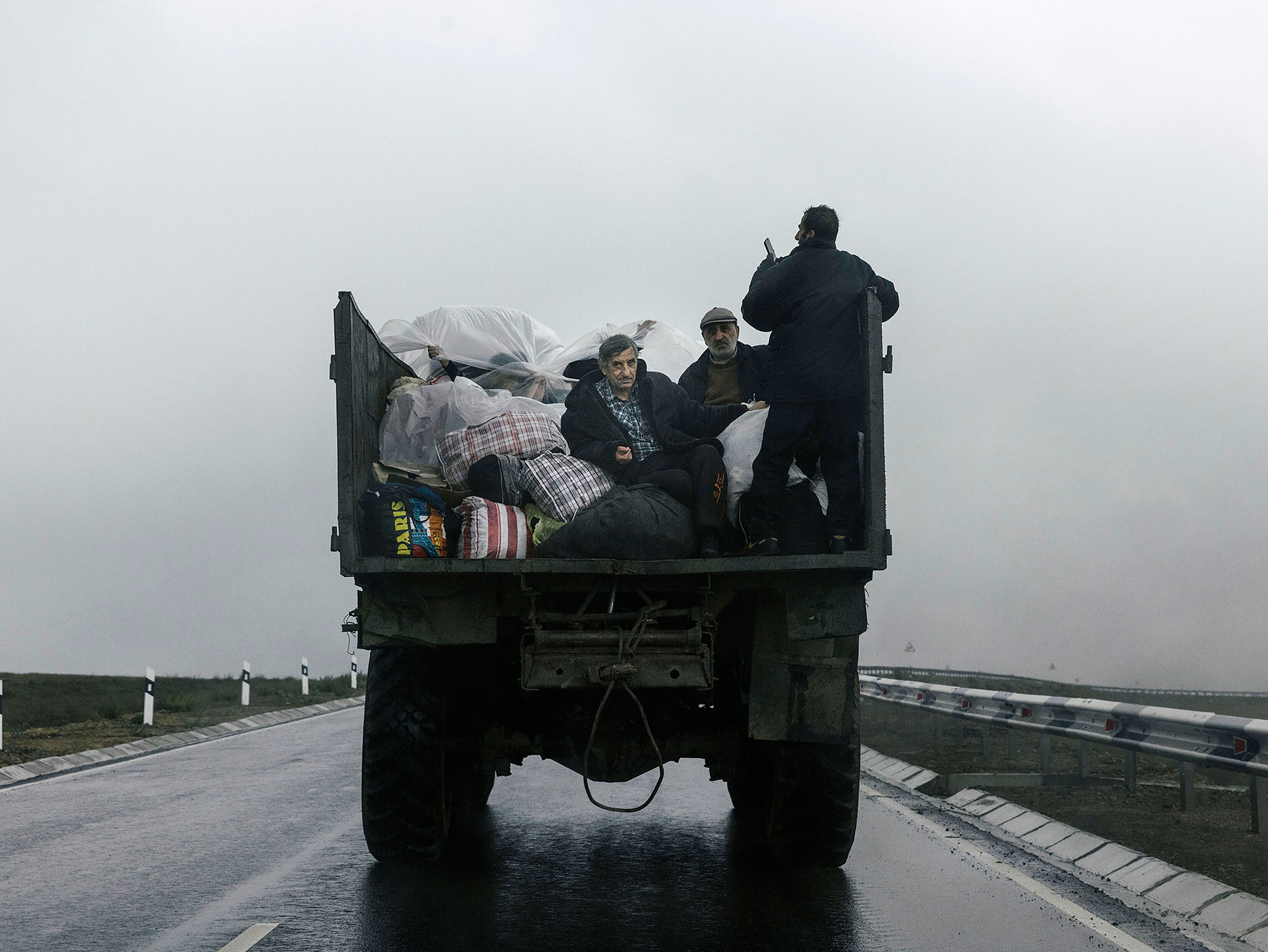 A vehicles carries refugees from Nagorno-Karabakhb as they arrive in Kornidzor, Armenia, on Sept. 25.