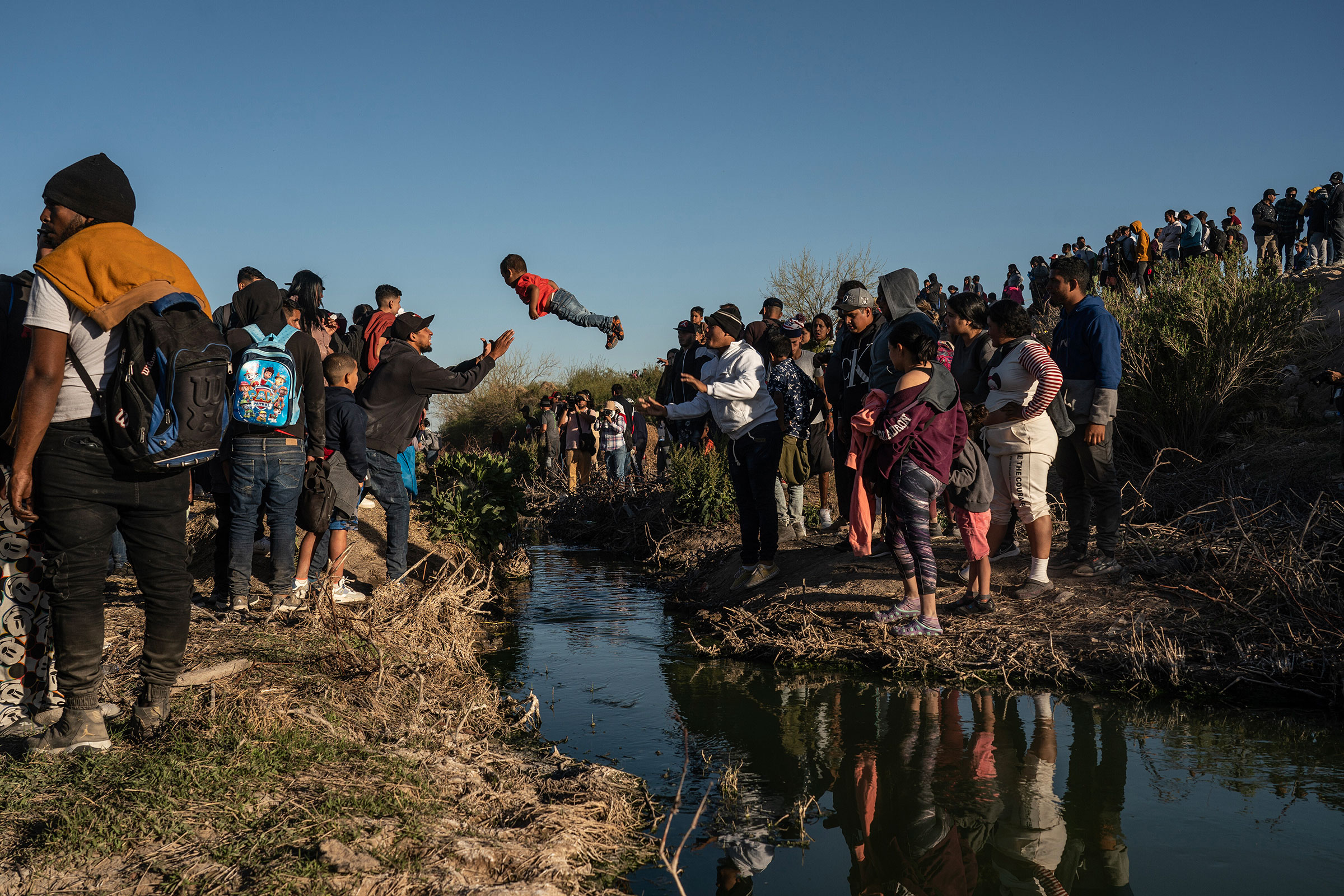 Asylum-seeking migrants mostly from Venezuela cross the Rio Grande river into the U.S., in Ciudad Juarez, Mexico, on March 29, 2023.
