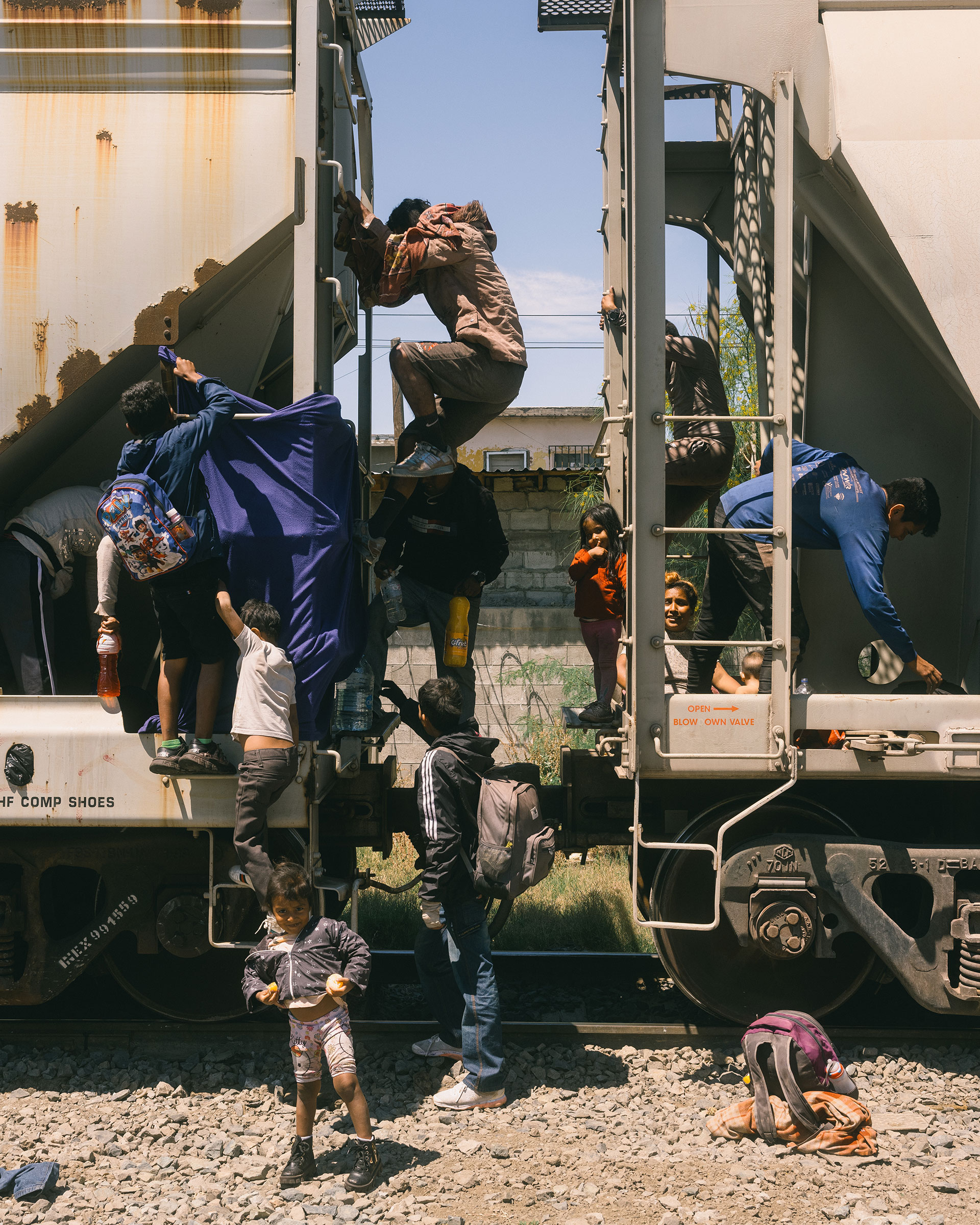 Migrant families from Venezuela disembark from the train known as ‘La Bestia,’ finally arriving at the U.S. Mexico border in Ciudad Juarez after months of travel, on May 16.