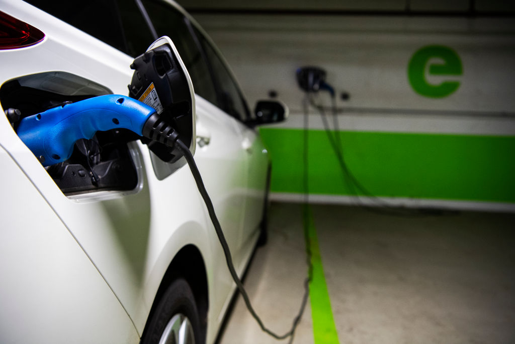 A Toyota Prius is seen connected to a electric vehicle charging station in a Washington, D.C., parking garage on March 31, 2021. (Tom Williams/CQ-Roll Call, Inc—Getty Images)