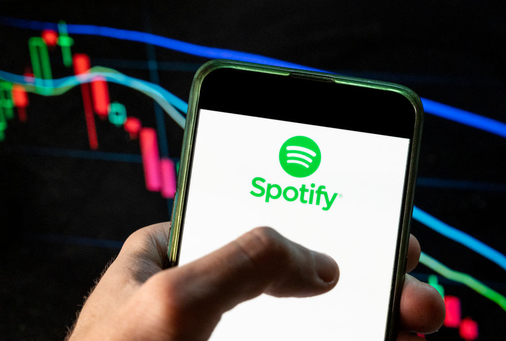 In this photo illustration, the logo of Spotify, a Swedish