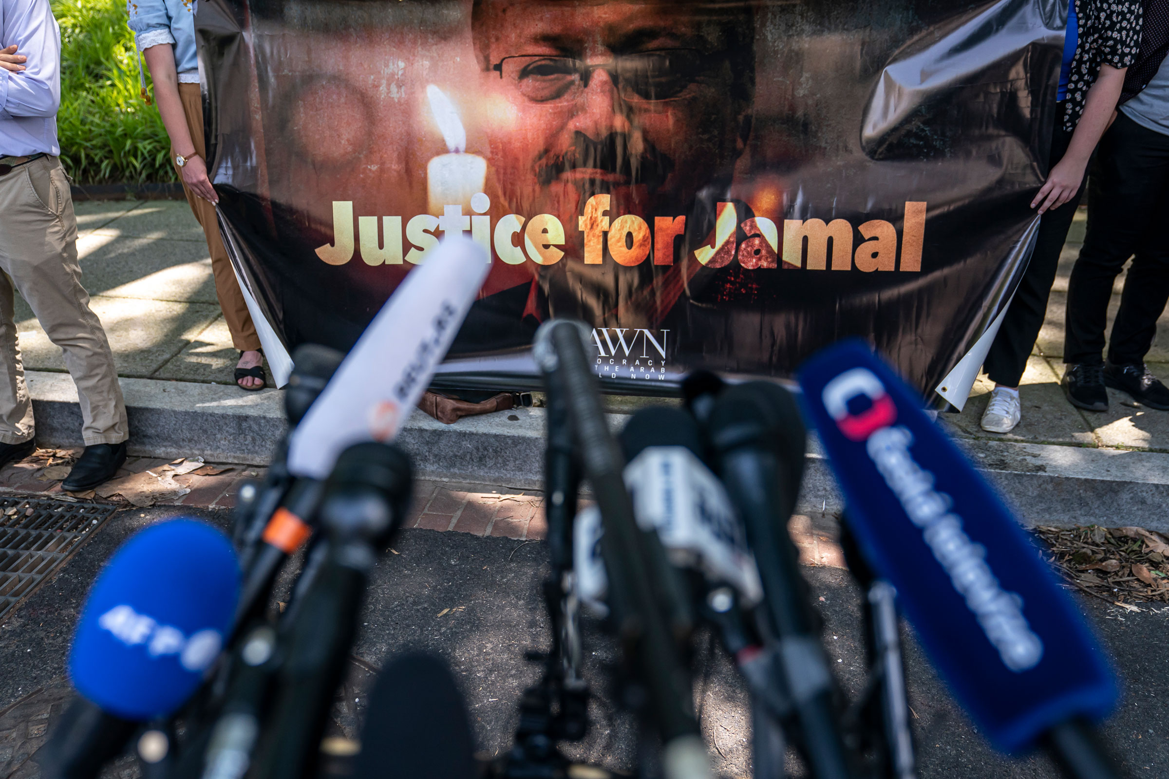 Human rights activists hold a banner calling for justice for the late Jamal Khashoggi