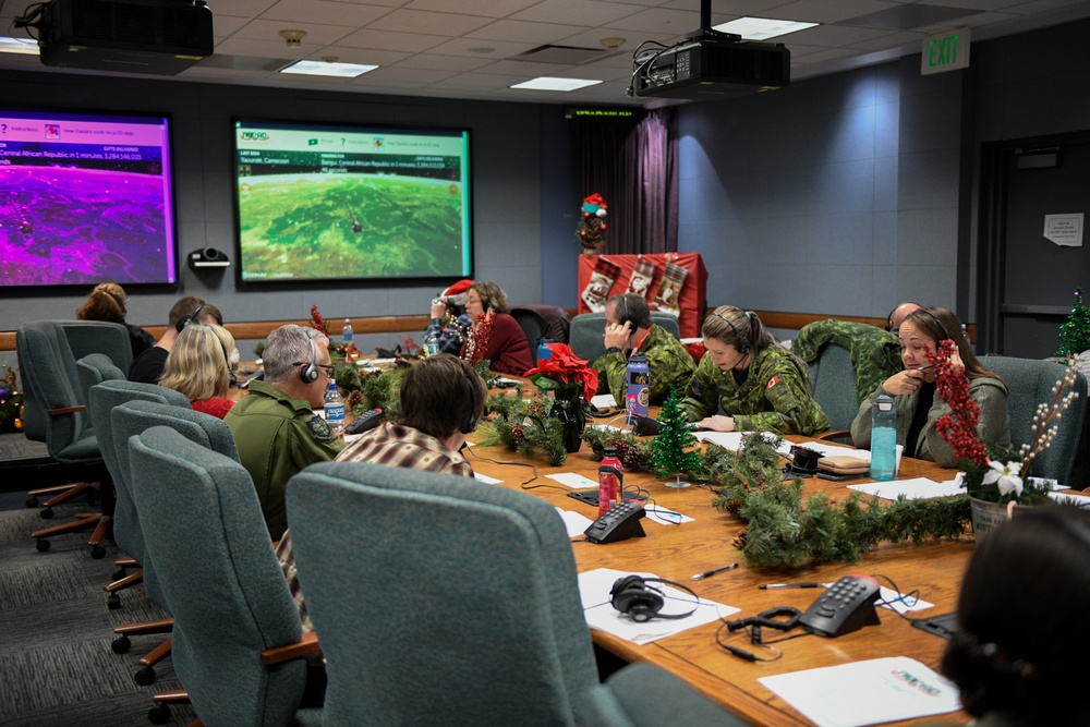 Volunteers at the NORAD Tracks Santa Operations Center on Peterson Space Force Base, Colo., on Dec. 24, 2022.