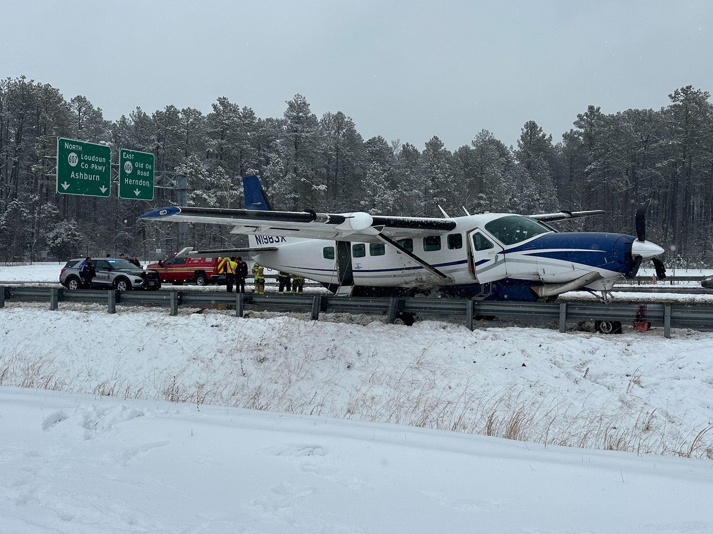 A photograph taken by a bystander showing a small aircraft after it emergency landed on a highway