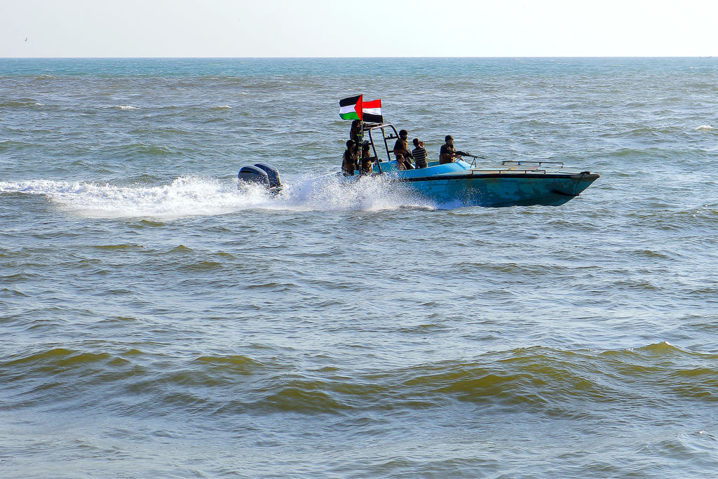 Members of the Yemeni Coast Guard affiliated with the Houthi group patrol the sea as demonstrators march through the Red Sea port city of Hodeida in solidarity with the people of Gaza on Jan. 4, 2024, amid the ongoing battles between Israel and the militant Hamas group in Gaza.