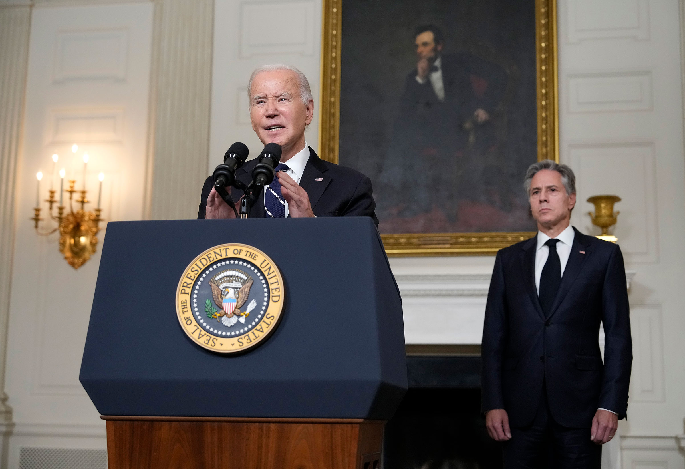 President Joe Biden, joined by Secretary of State Antony Blinken, delivers remarks on the Hamas terrorist attacks in Israel in the State Dining Room of the White House on Oct. 10. (Drew Angerer—Getty Images)