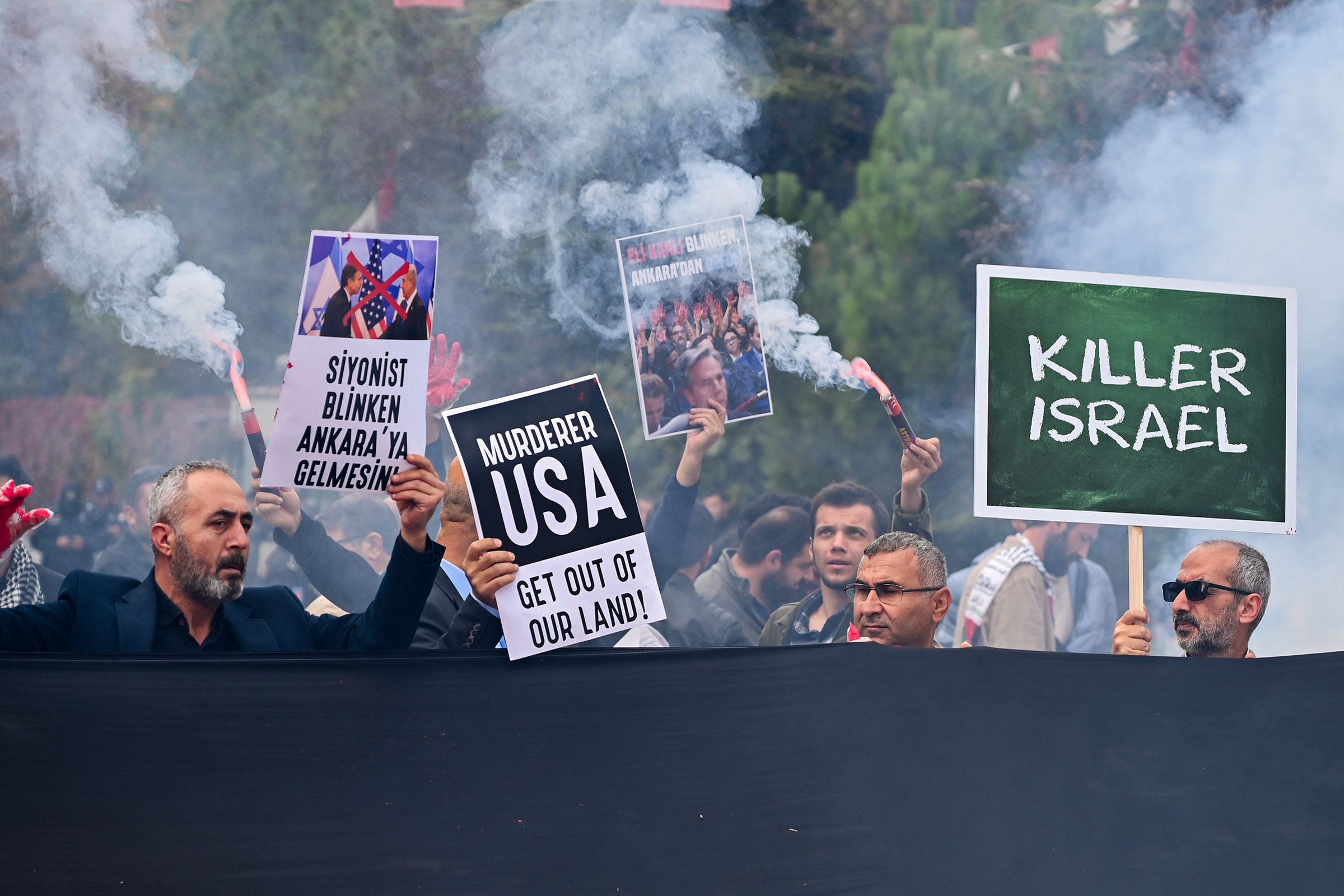 People hold up placards during a pro Palestinians protest outside Turkish Foreign Affairs Ministry in Ankara, Turkey, on Nov. 6. (Ali Unal—AP)