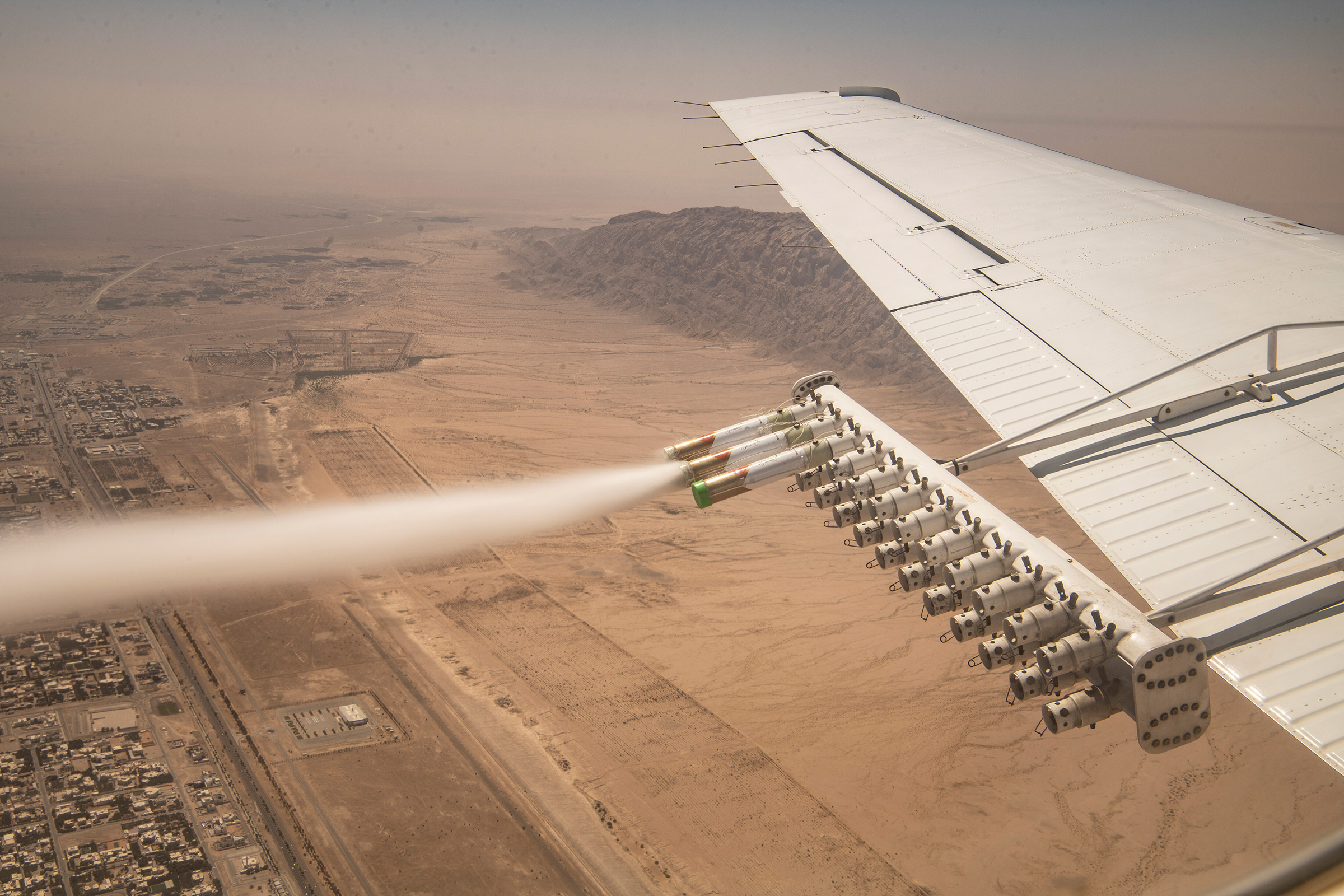 Experimental nanomaterial is released for the National Center of Meteorology and Seismology during a demonstration cloud seeding flight over in Al Ain, UAE, on March 3, 2022.