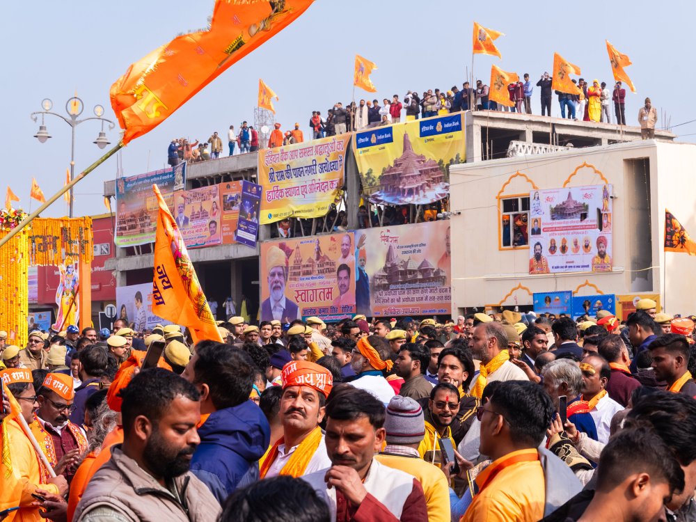 Devotees gather on the streets and the rooftops across Ayodhya to watch the live telecast and also catch a glimpse of celebrities invited to the consecration ceremony on Jan. 22.