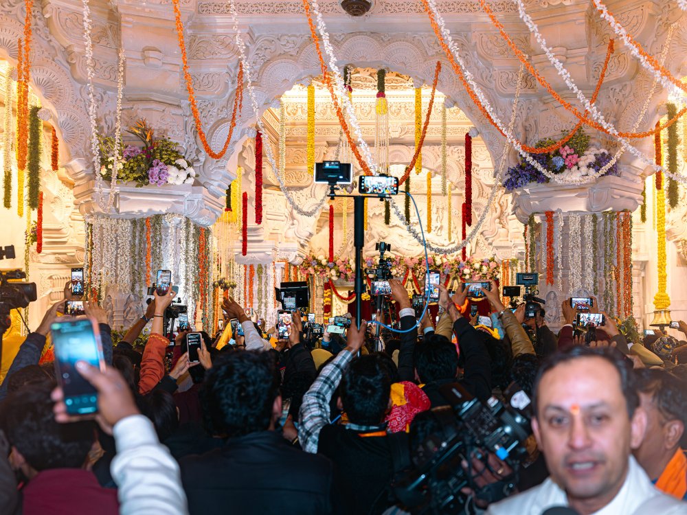 Mediapersons throng the room of the sanctum sanctorum to get a glimpse of the newly consecrated Ram Lalla idol.