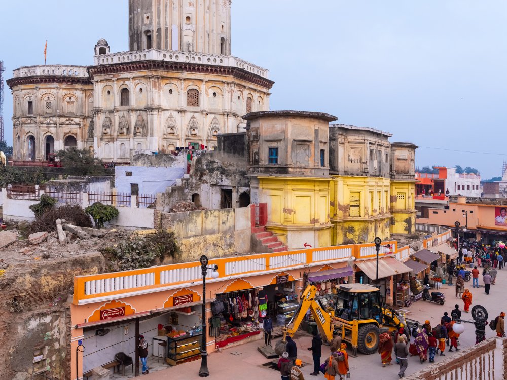 Ayodhya is a city under construction. An important throughfare in Ayodhya leading to the Hanuman Garhi temple is lined with shops that have recently received a government-sponsored facelift, on Jan. 17. The Raj Dwar temple (seen on the left) is an example of a structure that has not yet benefited from just-in-time renovation.