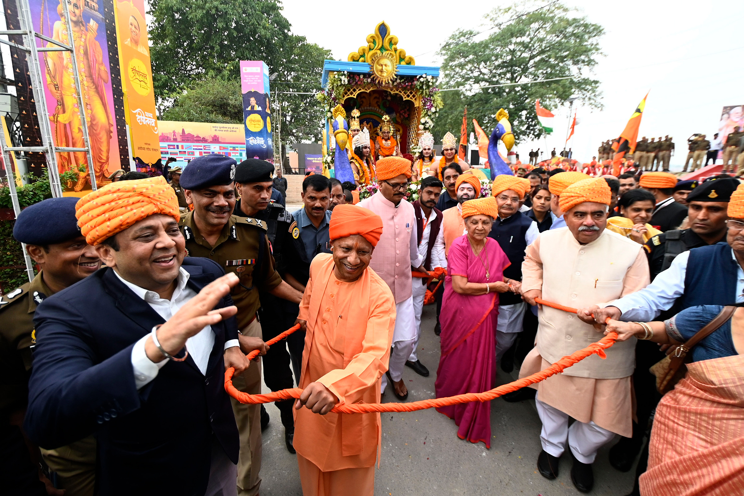 Uttar Pradesh Chief Minister Yogi Adityanath, center, with Governor Anandiben Patel welcome artists dressed up as Lord Rama, Sita, and Lakshman during Diya Deepotsav celebrations in Ayodhya on Nov. 11, 2023.