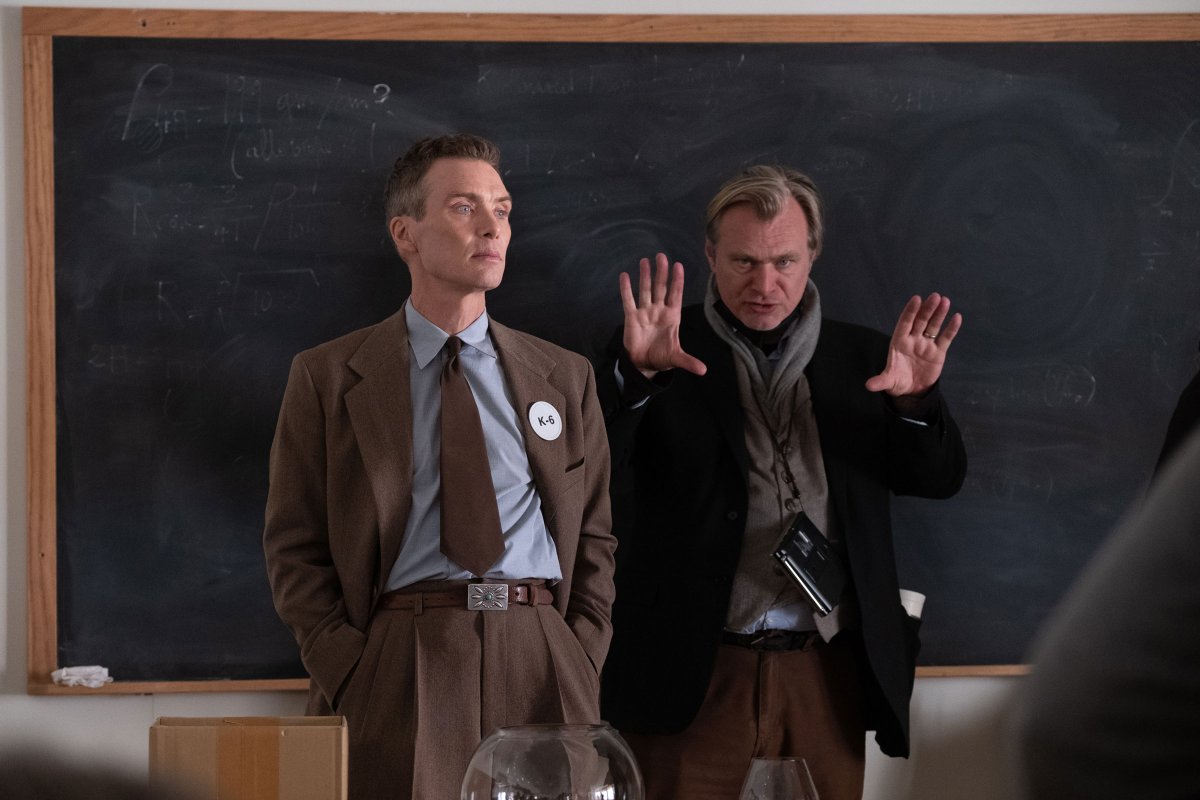 Cillian Murphy (as J. Robert Oppenheimer) and Christopher Nolan on the set of Oppenheimer