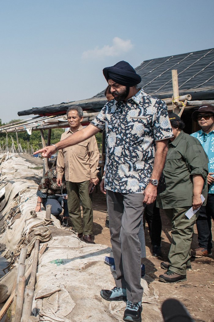 World Bank President Ajay Banga, right, at work in Indonesia
