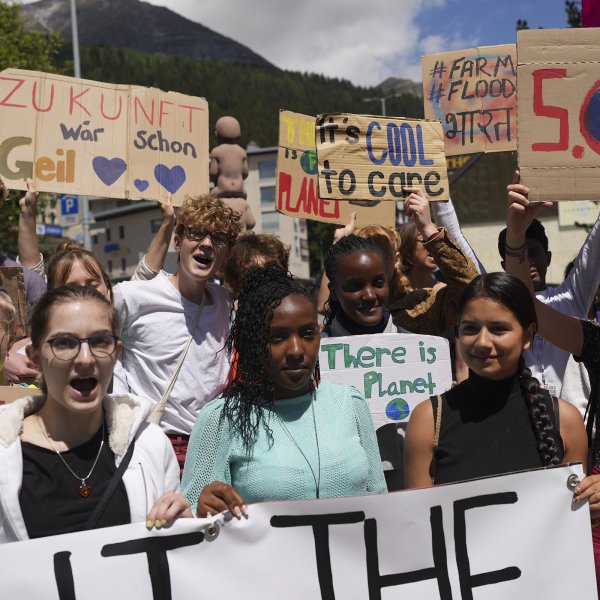 Elizabeth Wathuti protests alongside climate activists Vanessa Nakate and Helena Gualinga at the World Economic Forum in Davos, Switzerland, May 26, 2022.