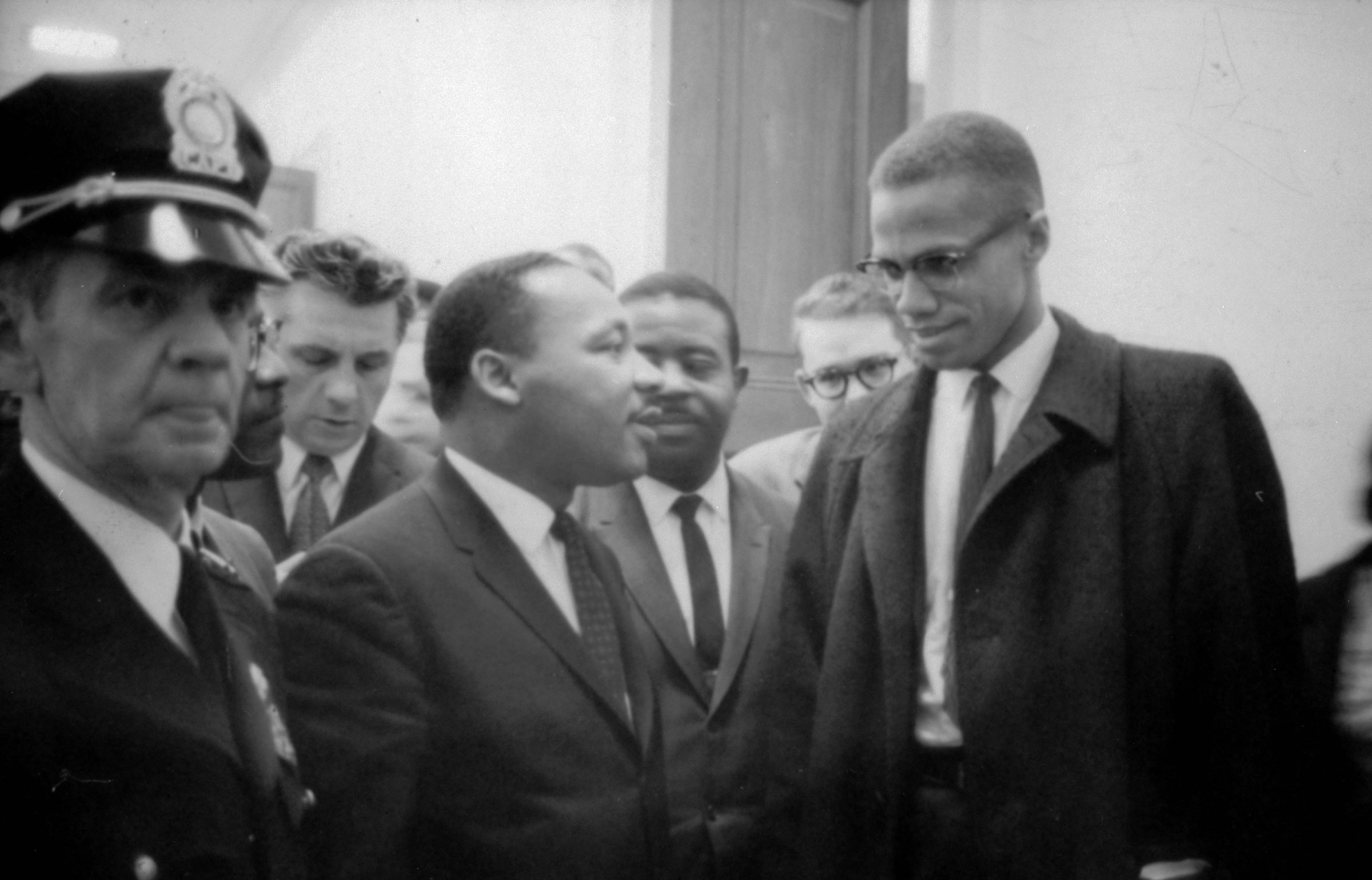 Martin Luther King Jr. and Malcolm X waiting for a press conference, on March 26, 1964.