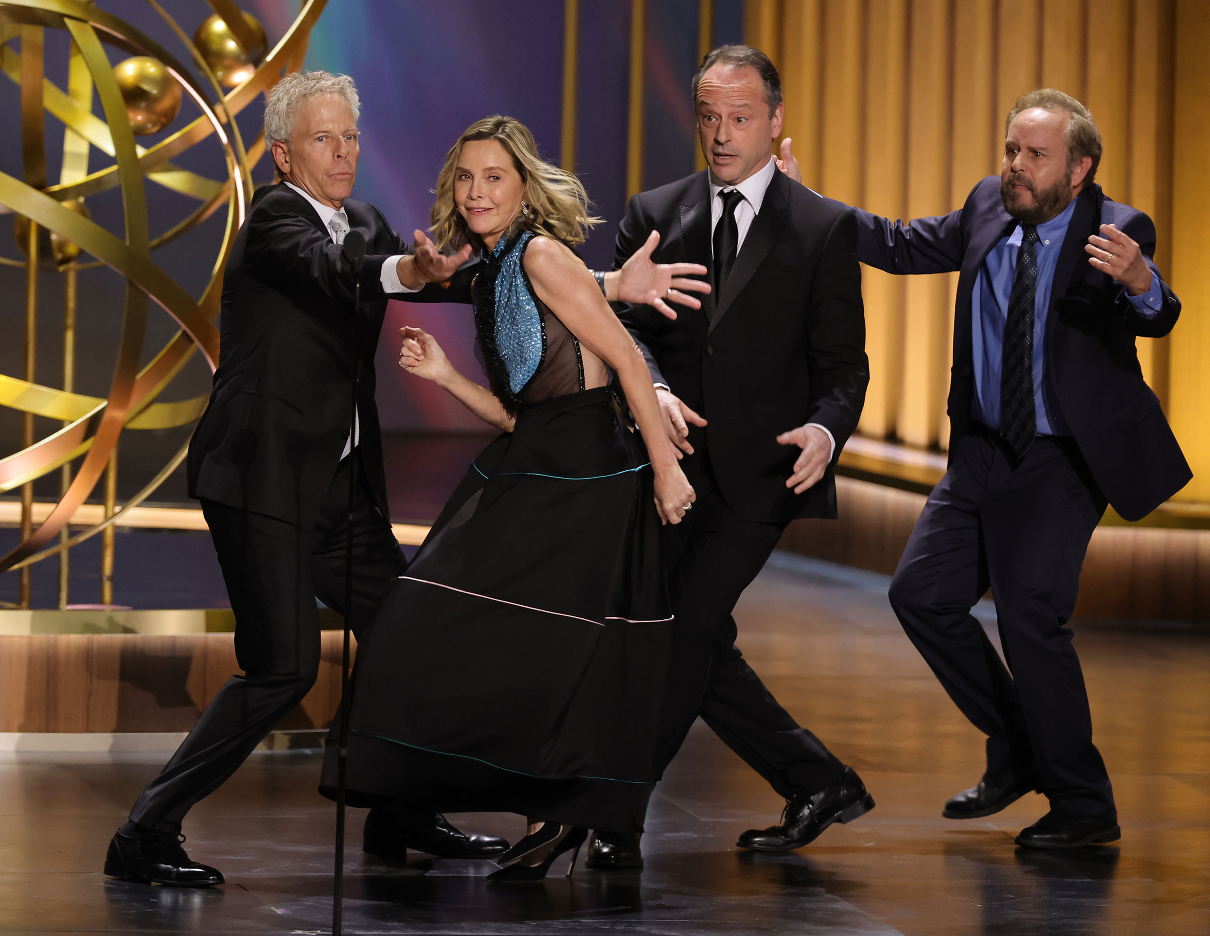 "Ally McBeal" cast members Greg Germann, Calista Flockhart, Gil Bellows and Peter MacNicol dance onstage during the 75th Primetime Emmy Awards on Jan. 15, 2024.