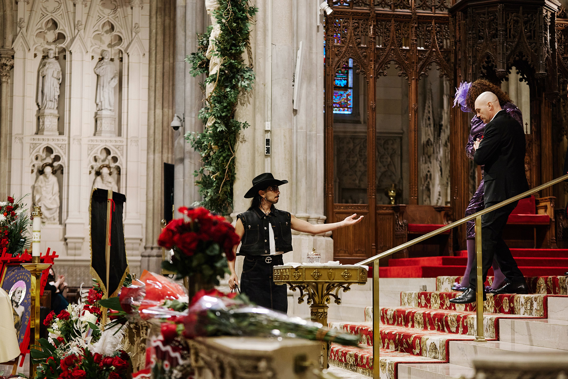 Oscar Diaz reaches out to Ceyenne Doroshow and Peter Scotto during the funeral services for Cecilia Gentili at St. Patricks Cathedral in New York City, on Feb. 15, 2024.
