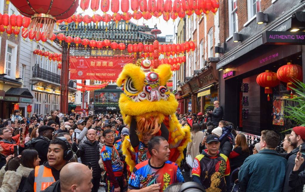 Lion dancers perform to bring good luck to restaurants and