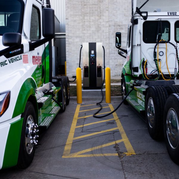 Daimler Freightliner eCascadia all-electric semitrucks charge at a Meijer distribution center in Lansing, Michigan, on Feb. 14, 2023.
