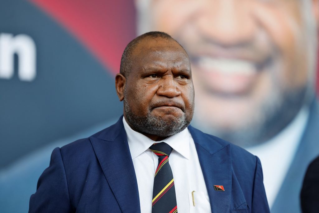 Papua New Guiney Prime Minister James Marape waits for French President Emmanuel Macron at APEC haus in Port Moresby on July 28, 2023.