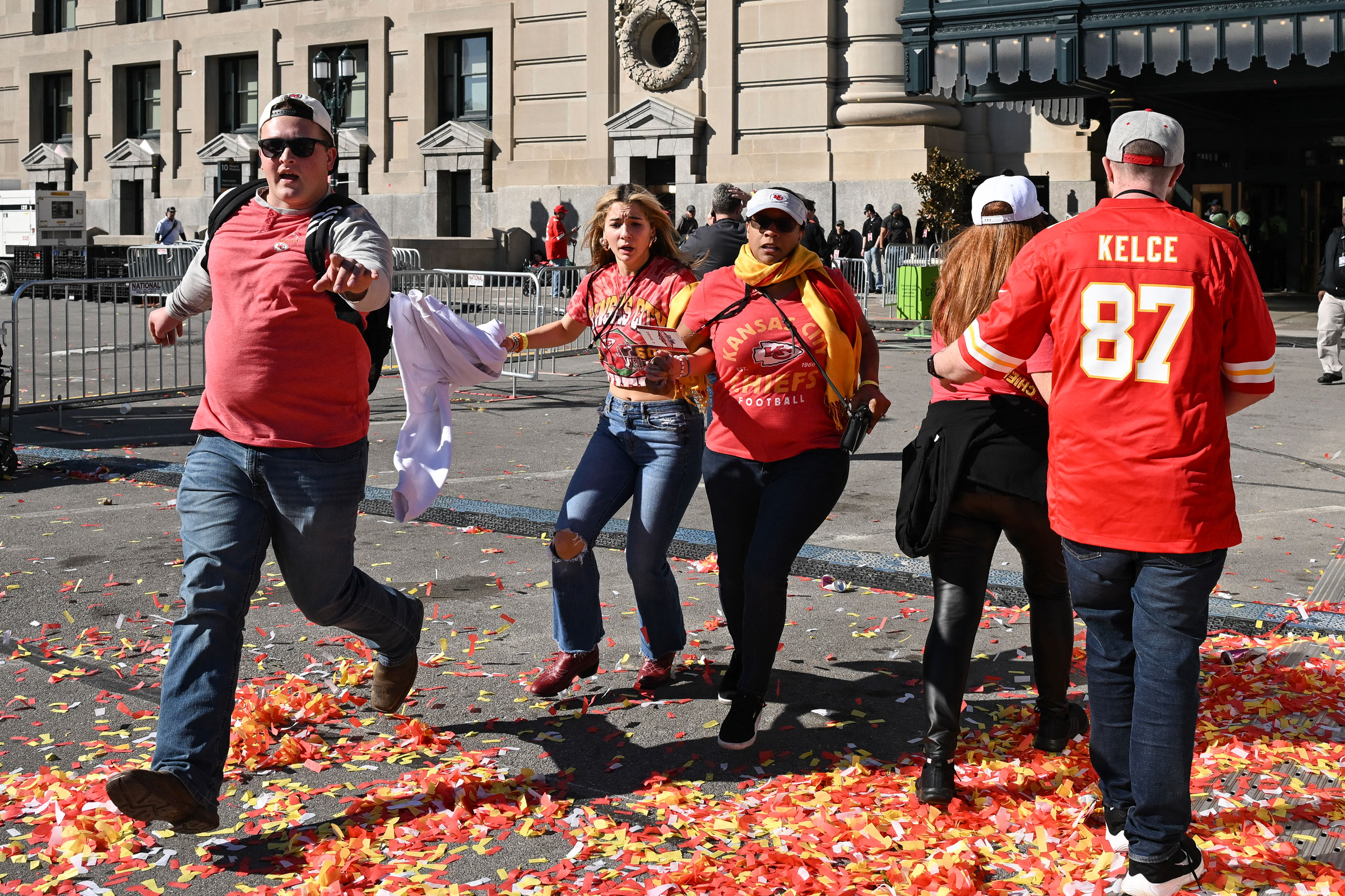 People flee after shots were fired near the Kansas City Chiefs' Super Bowl LVIII victory parade.