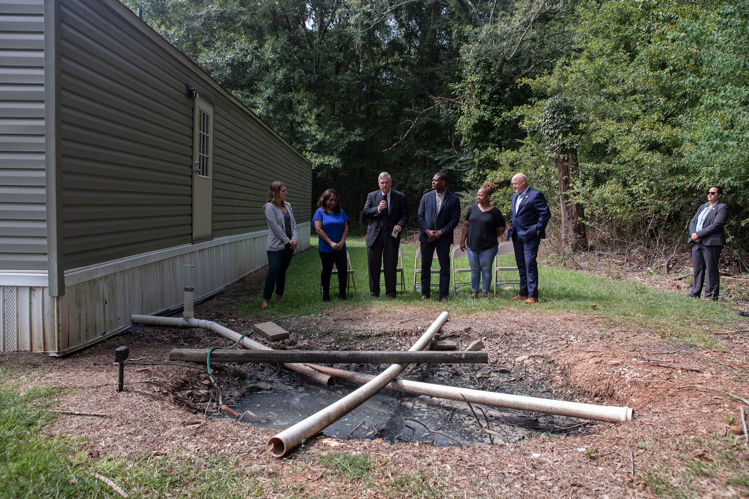 EPA Administrator Michel Regan speaks to the press in a resident's backyard in Lowndes County Alabama on August 2st, 2022.